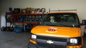 Water Damage Restoration SUV and Dog At Warehouse